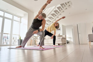 Picture of an older couple doing yoga.