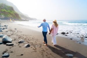 Online HGH Prescription Picture of an older couple walking on the beach.